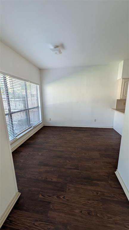 304 Benjamin Street Denton, TX 76207 - Photo 2 of 8 wooden floor in an empty room with a window