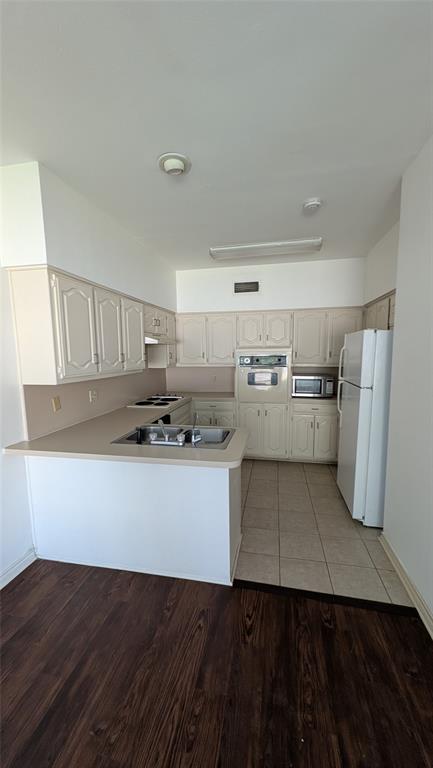 304 Benjamin Street Denton, TX 76207 - Photo 3 of 8 a kitchen with stainless steel appliances a refrigerator and a stove