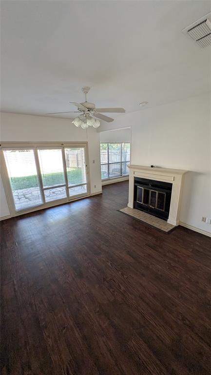304 Benjamin Street Denton, TX 76207 - Photo 5 of 8 wooden floor in an empty room with a window