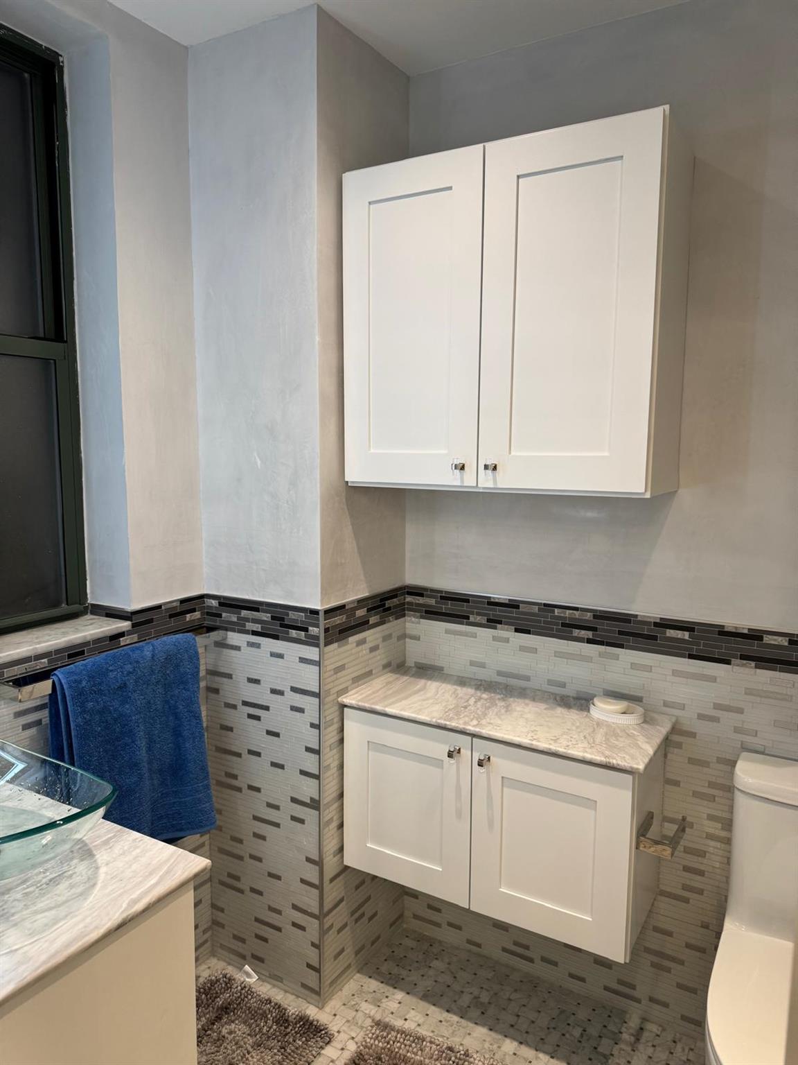 595 West End Avenue, Unit 3D Manhattan, NY 10024 - Photo 7 of 28 Bathroom with tile patterned floors, vanity, tile walls, and toilet