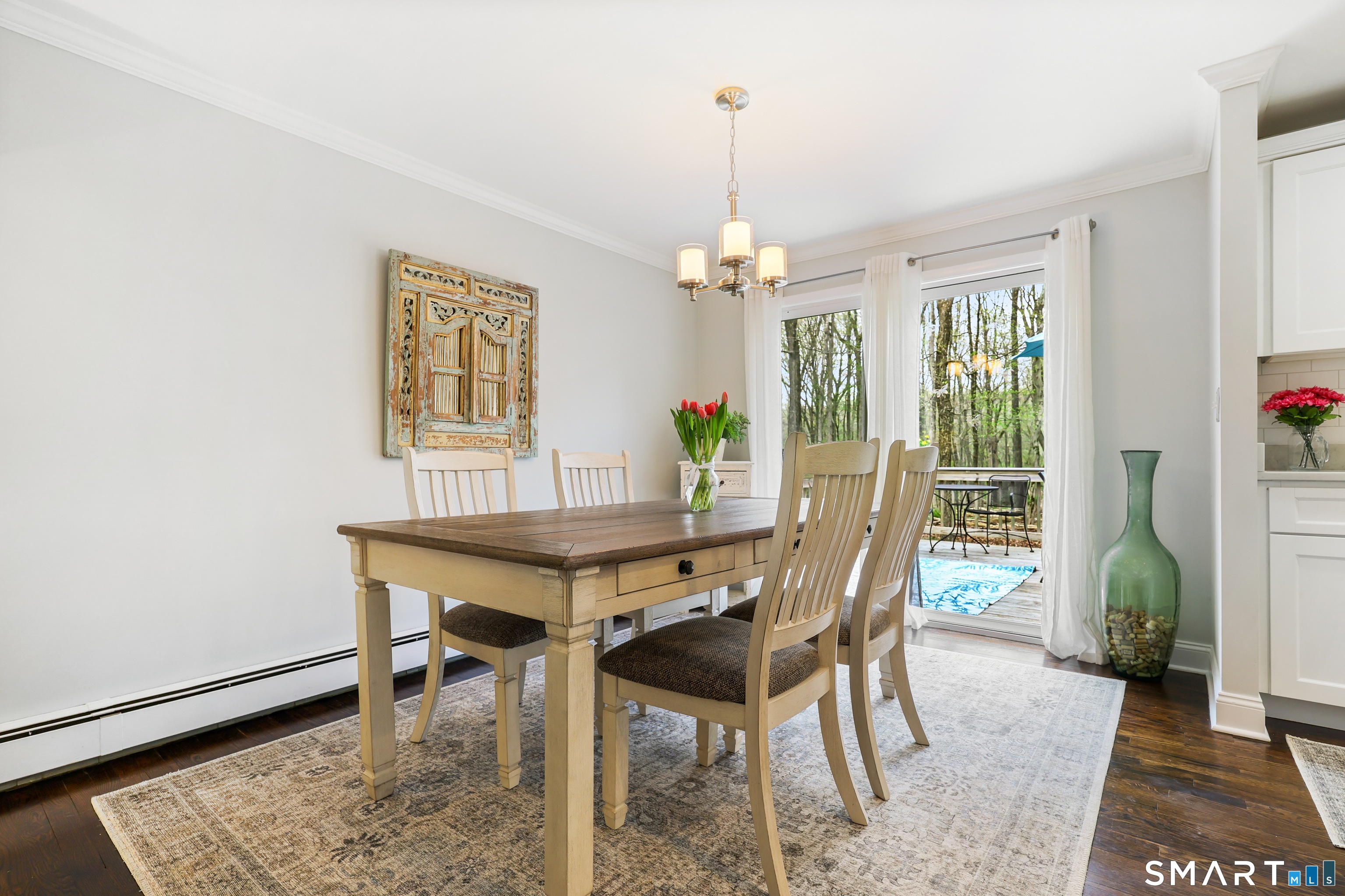 100 Flat Rock Drive Ridgefield, CT 06877 - Photo 11 of 40 a view of a dining room with furniture window and wooden floor