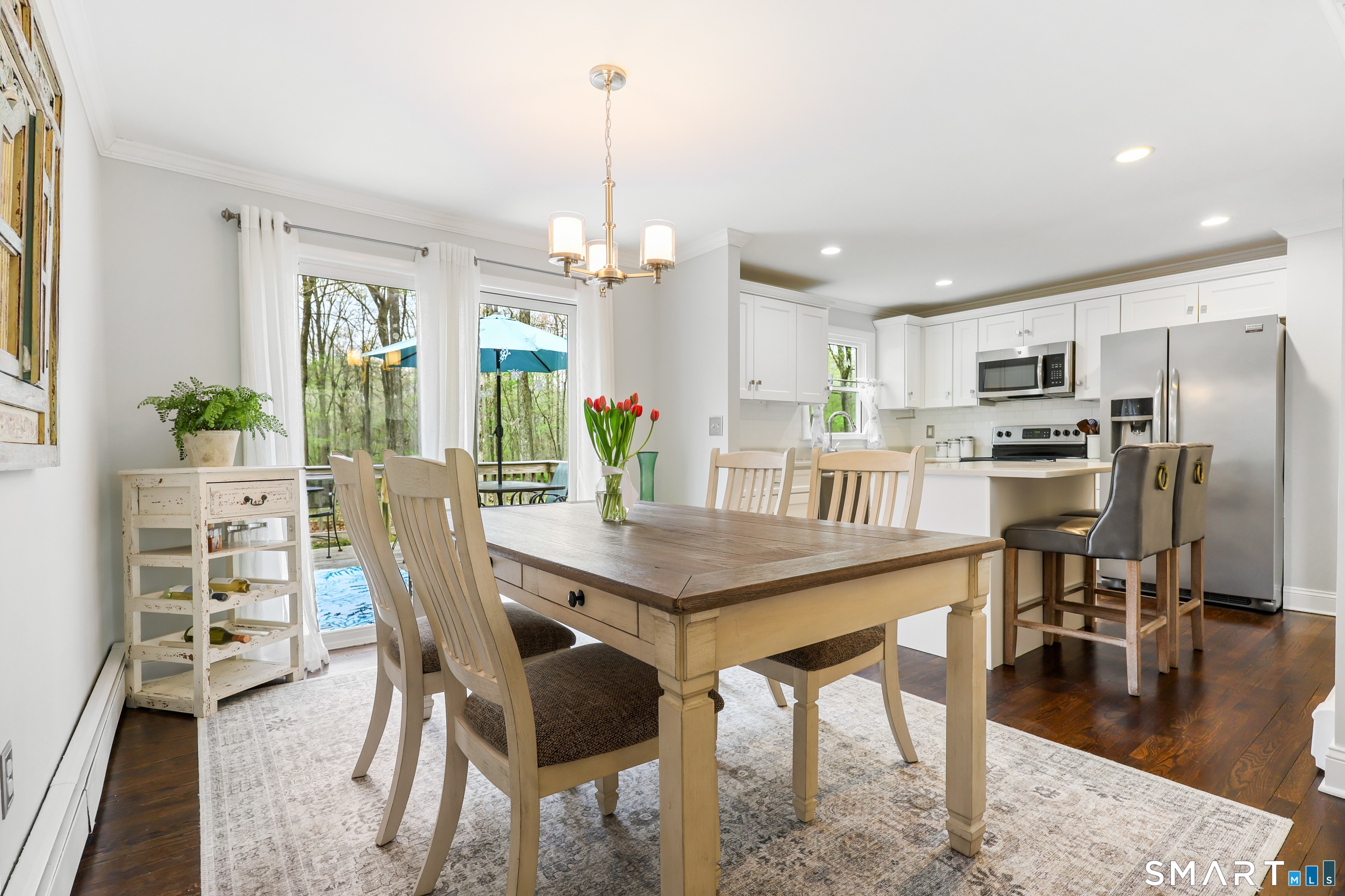 100 Flat Rock Drive Ridgefield, CT 06877 - Photo 12 of 40 a view of a dining room with furniture window and wooden floor