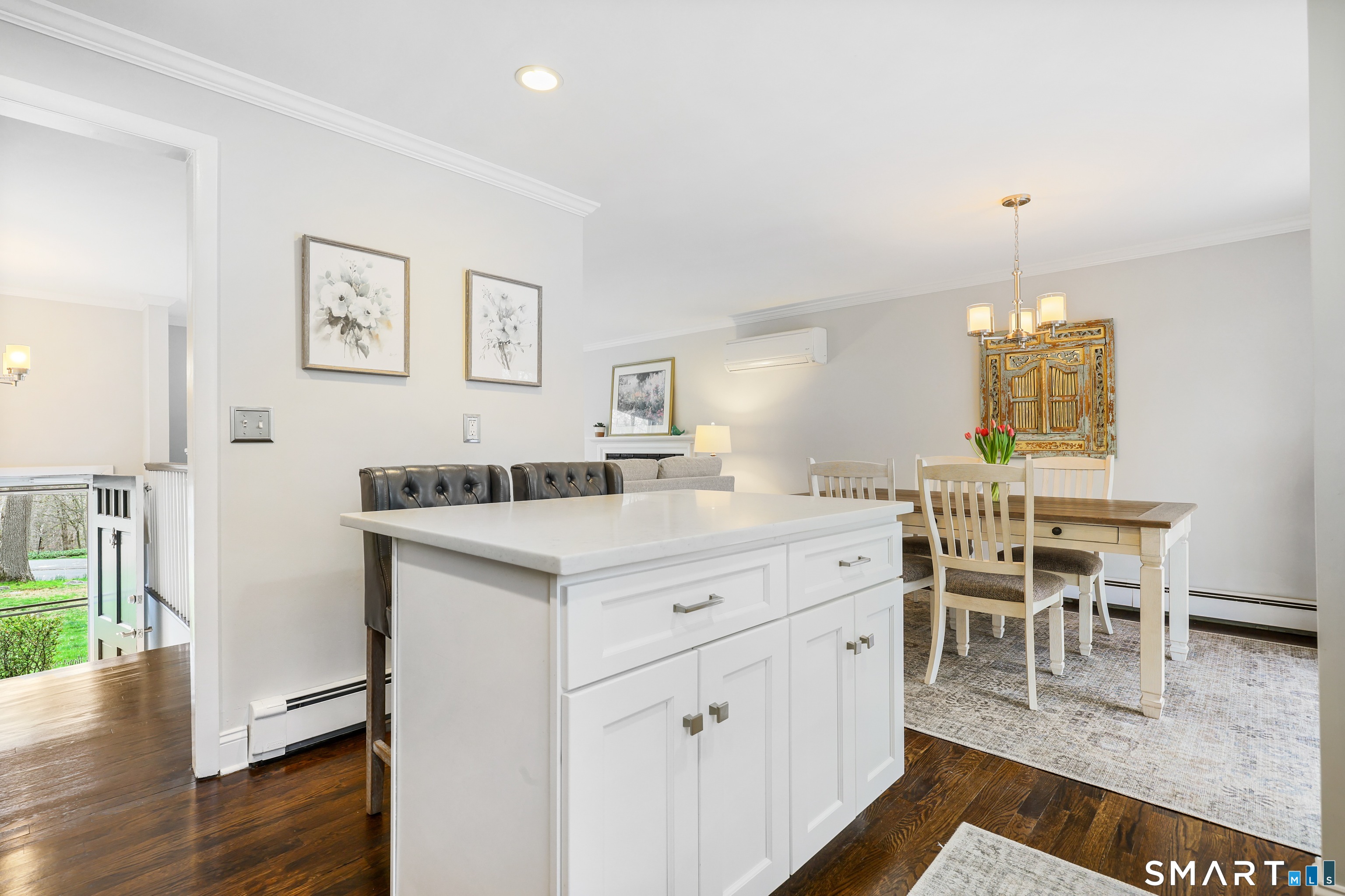 100 Flat Rock Drive Ridgefield, CT 06877 - Photo 15 of 40 a view of dining table chairs and wooden floor