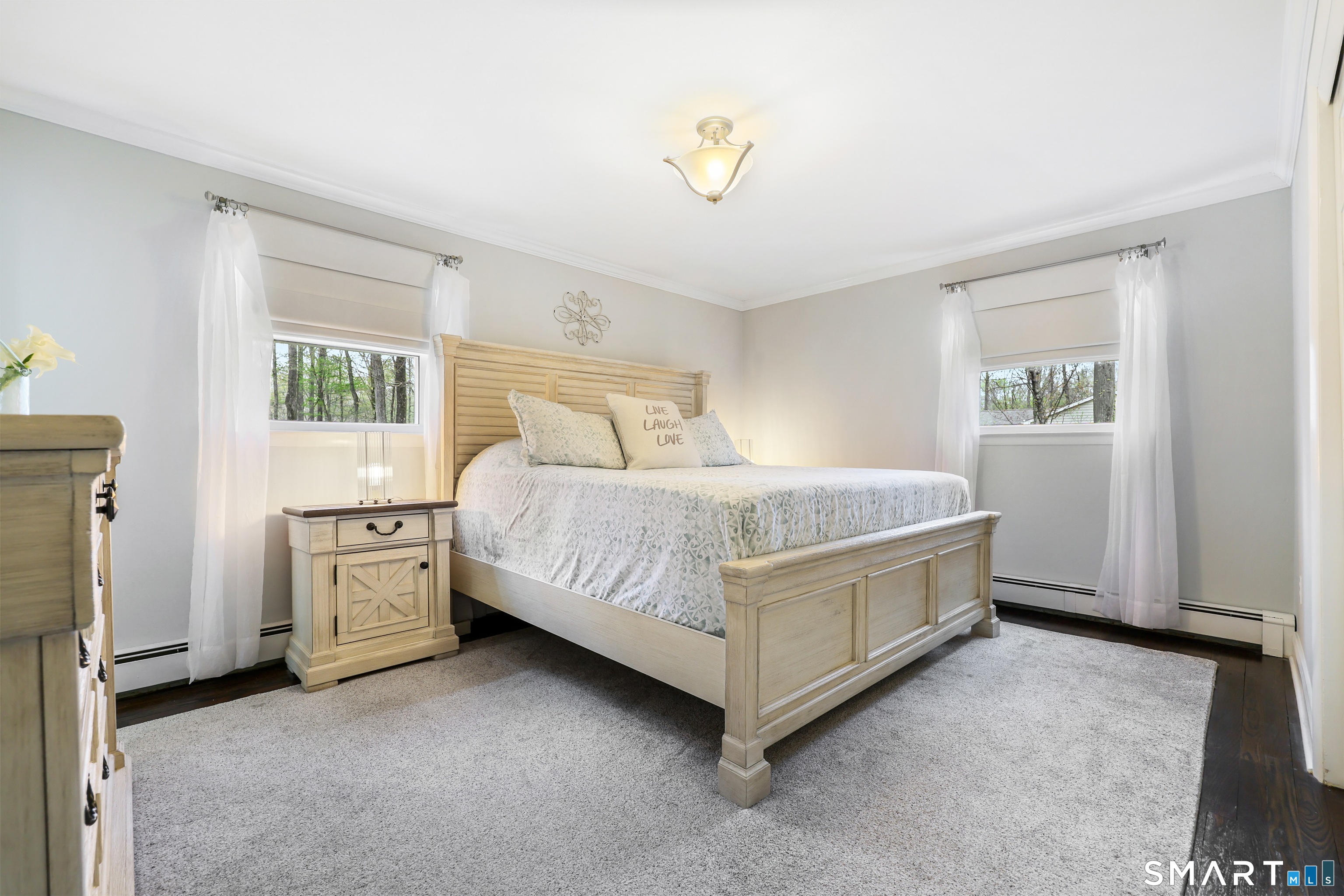 100 Flat Rock Drive Ridgefield, CT 06877 - Photo 17 of 40 a bedroom with a bed and a window
