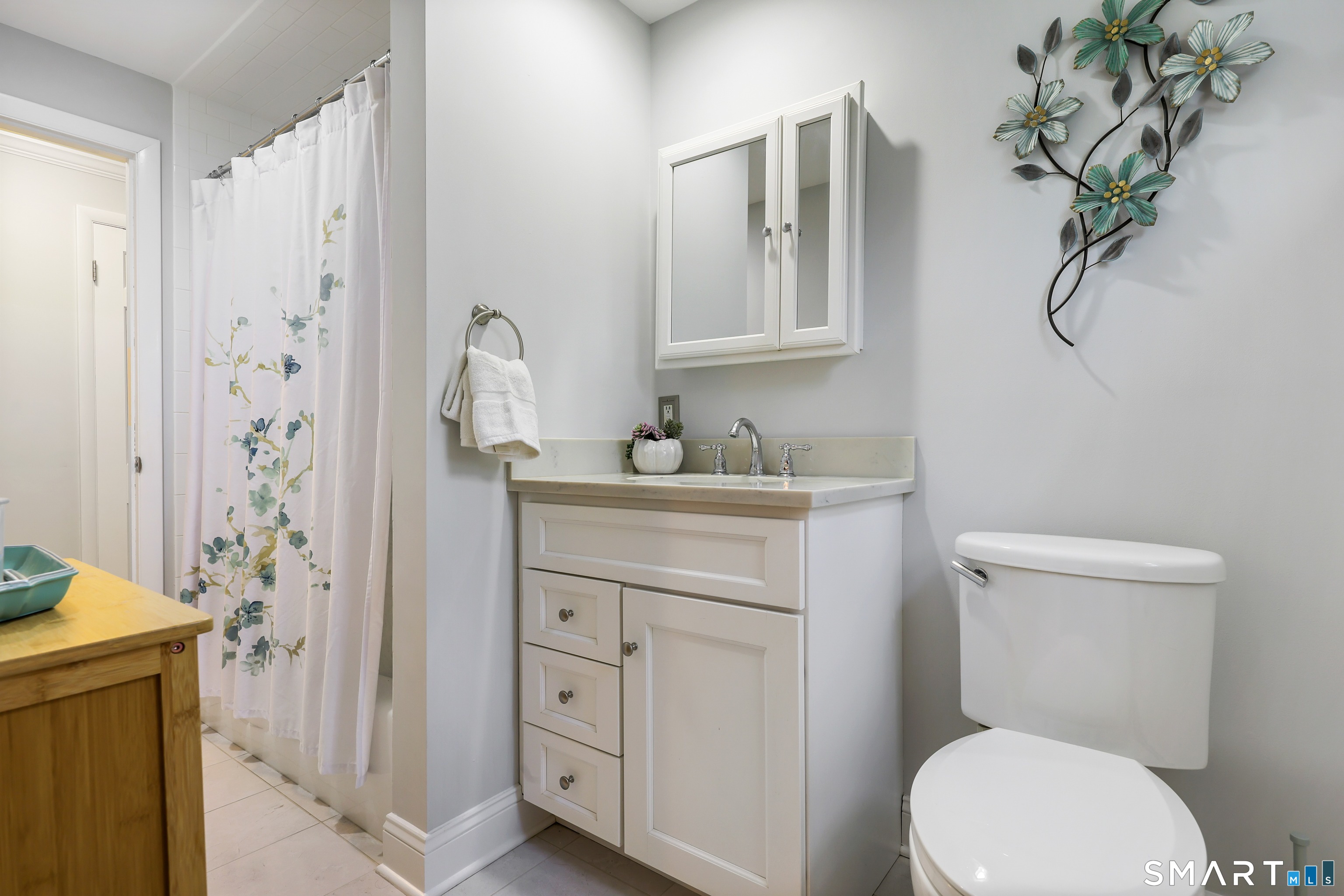 100 Flat Rock Drive Ridgefield, CT 06877 - Photo 19 of 40 a bathroom with a granite countertop sink toilet and shower