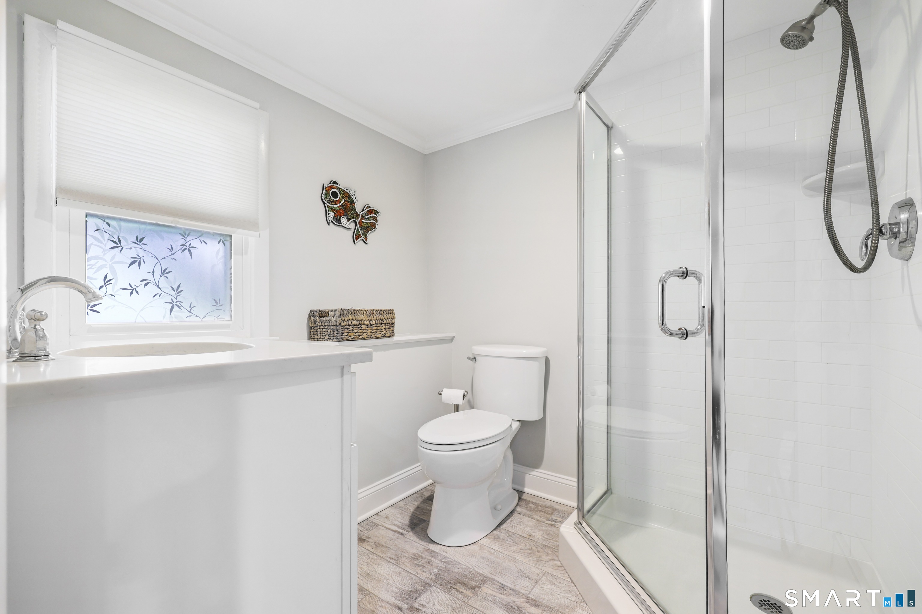 100 Flat Rock Drive Ridgefield, CT 06877 - Photo 27 of 40 a bathroom with a toilet sink and shower