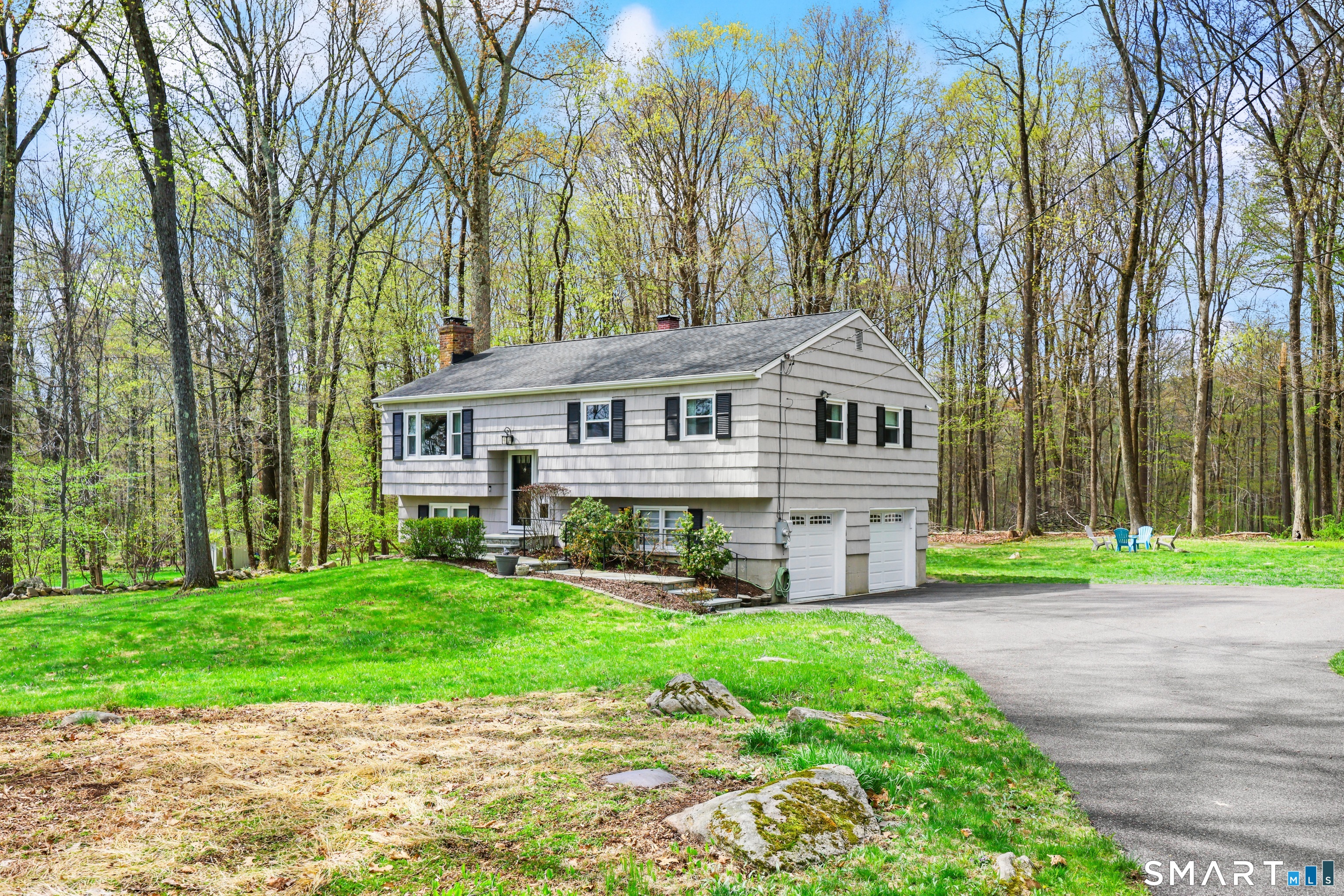 100 Flat Rock Drive Ridgefield, CT 06877 - Photo 28 of 40 a view of a house with a yard