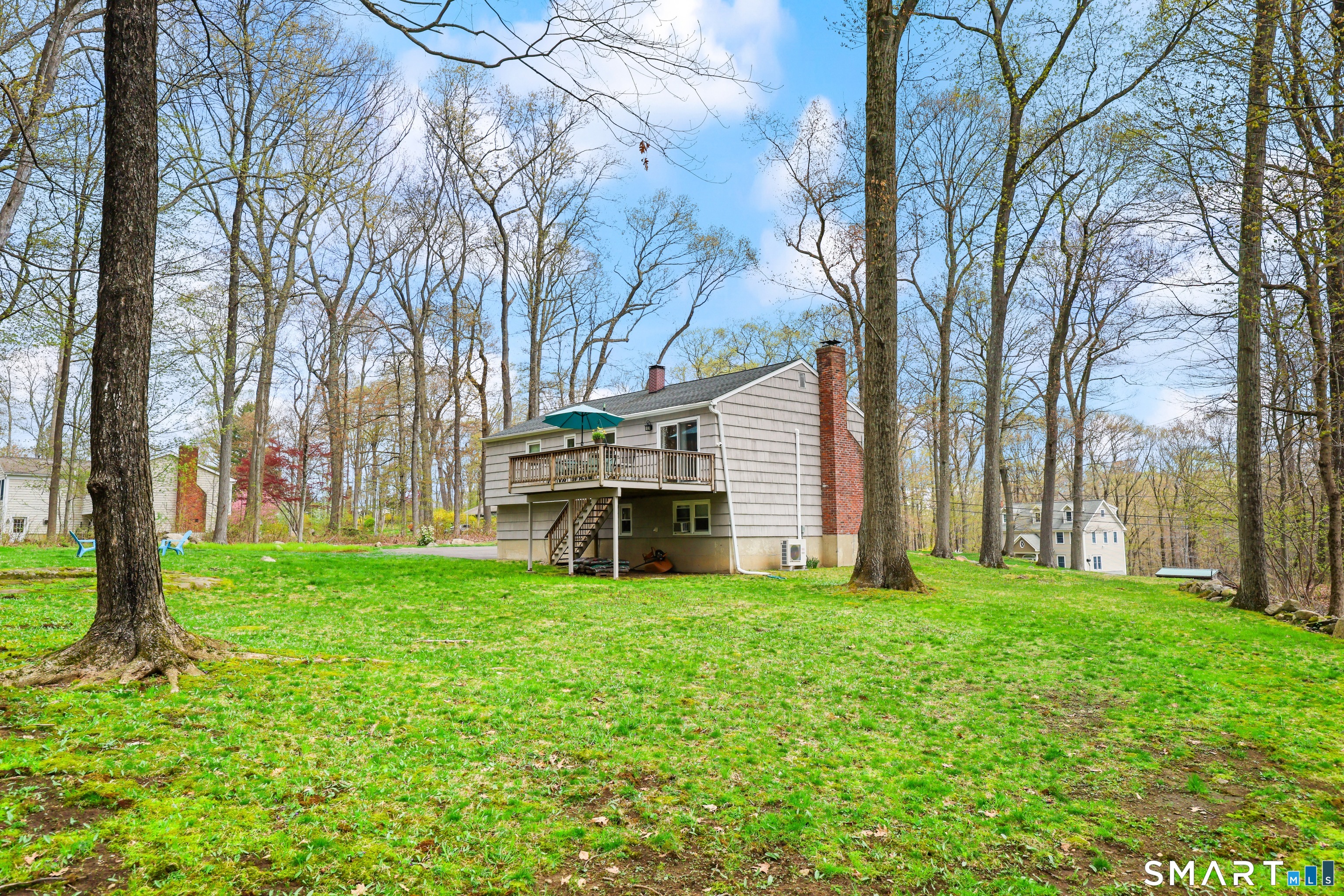 100 Flat Rock Drive Ridgefield, CT 06877 - Photo 29 of 40 a view of a yard with large trees