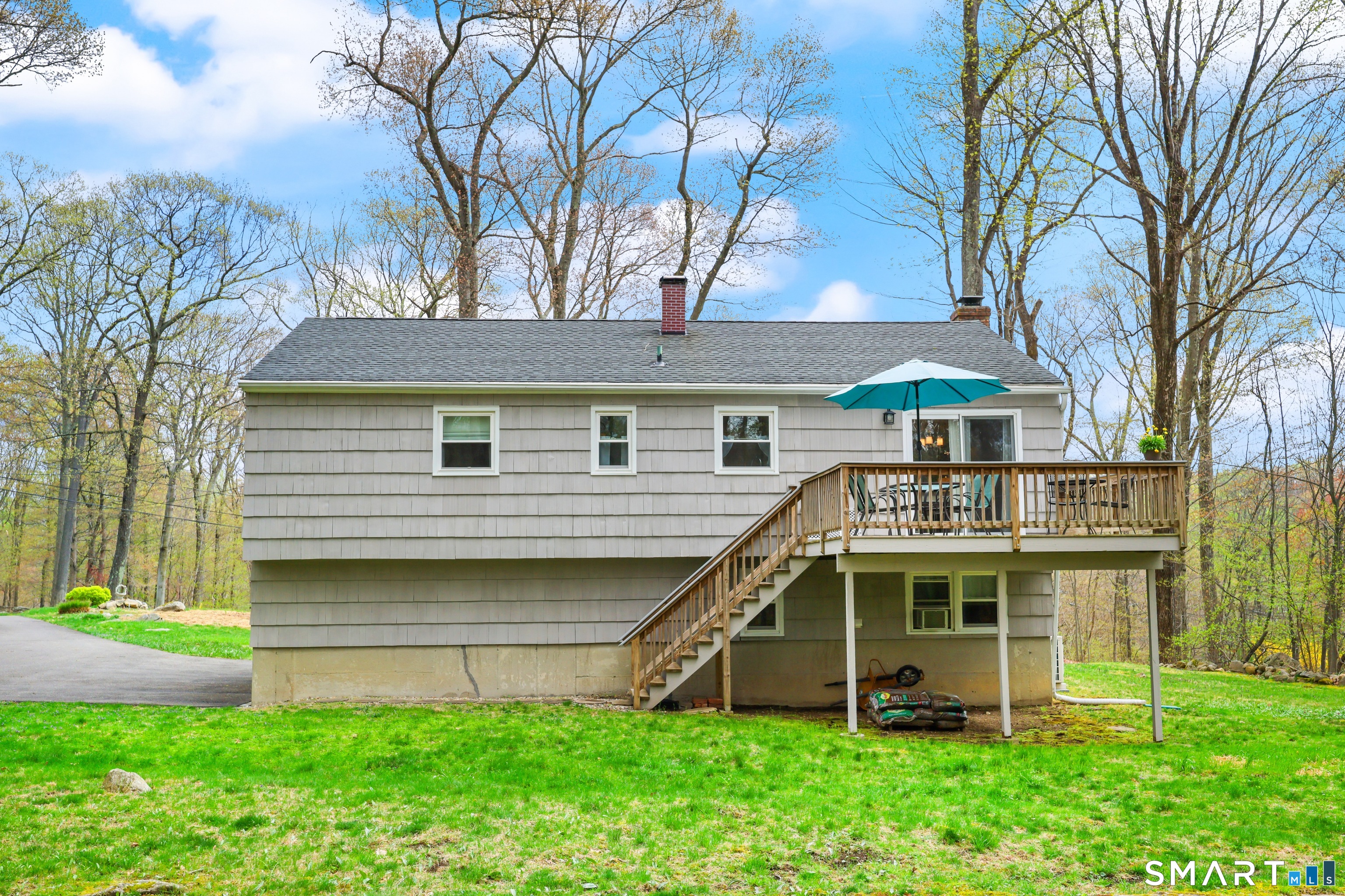 100 Flat Rock Drive Ridgefield, CT 06877 - Photo 31 of 40 a front view of a house with garden