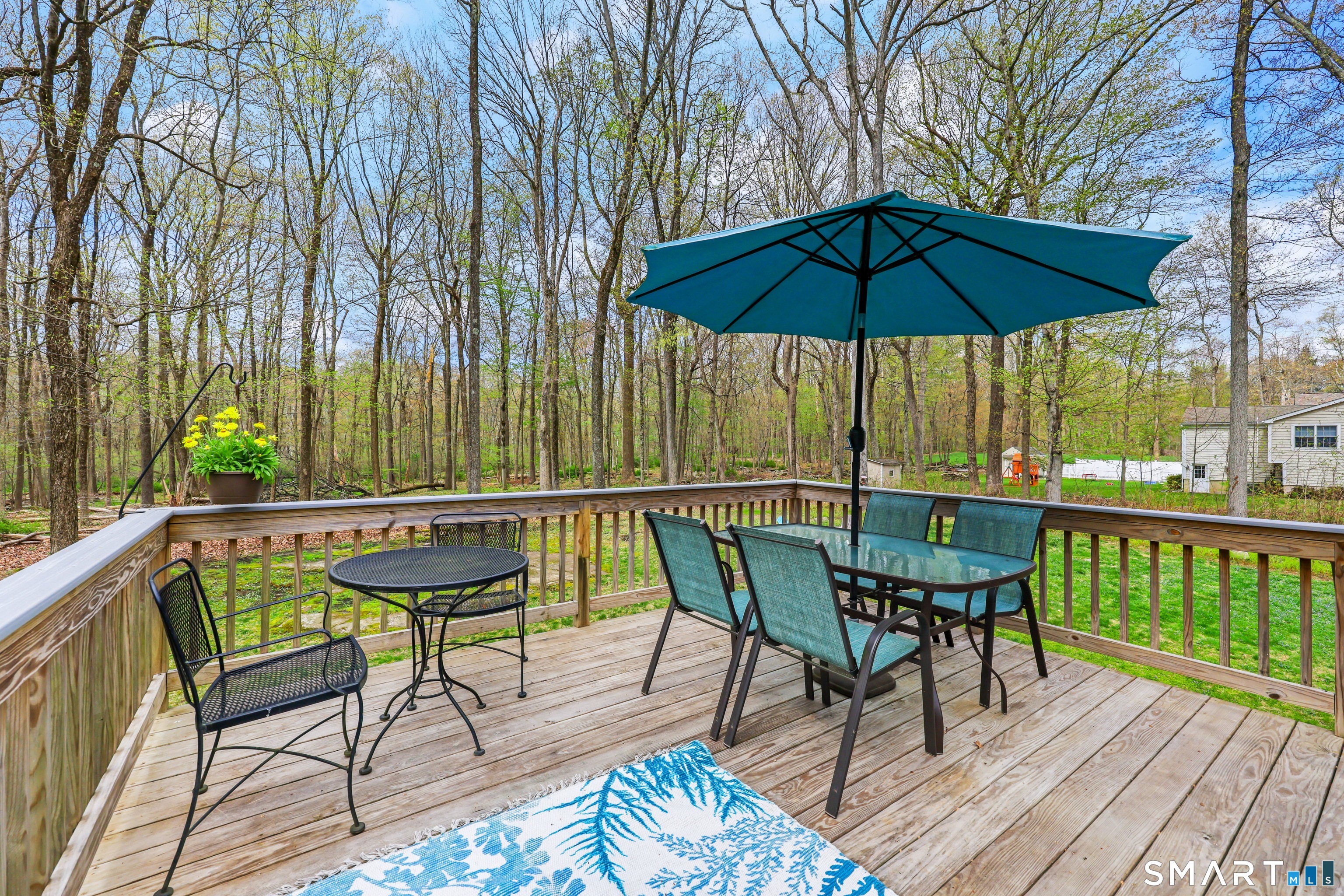 100 Flat Rock Drive Ridgefield, CT 06877 - Photo 34 of 40 a view of deck with furniture and umbrella