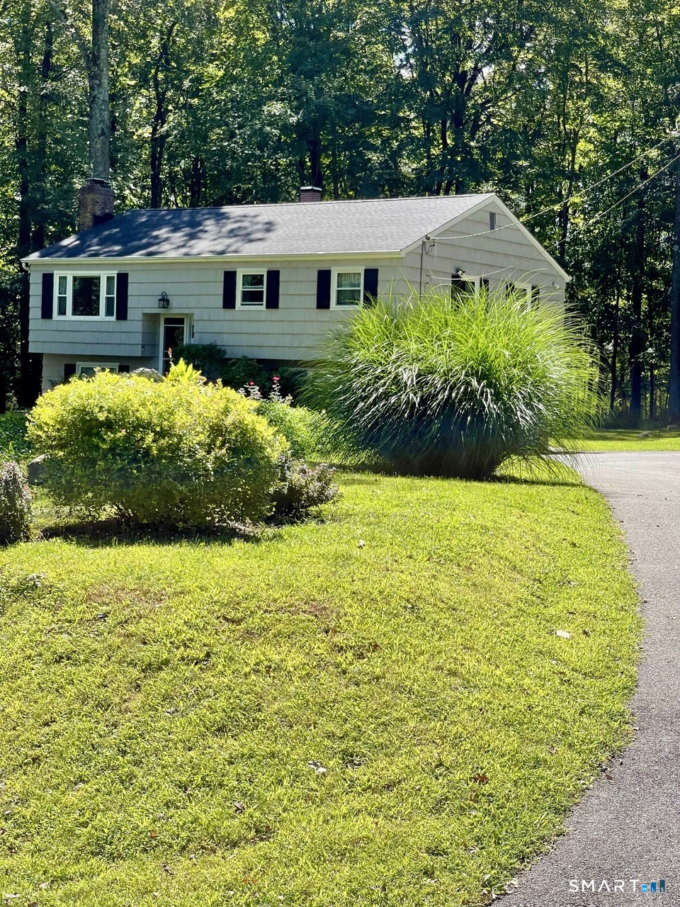 100 Flat Rock Drive Ridgefield, CT 06877 - Photo 39 of 40 a front view of a house with garden