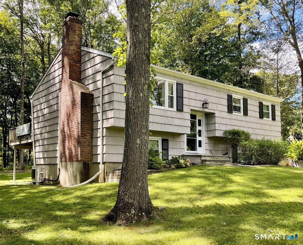 100 Flat Rock Drive Ridgefield, CT 06877 - Photo 40 of 40 a front view of a house with a yard