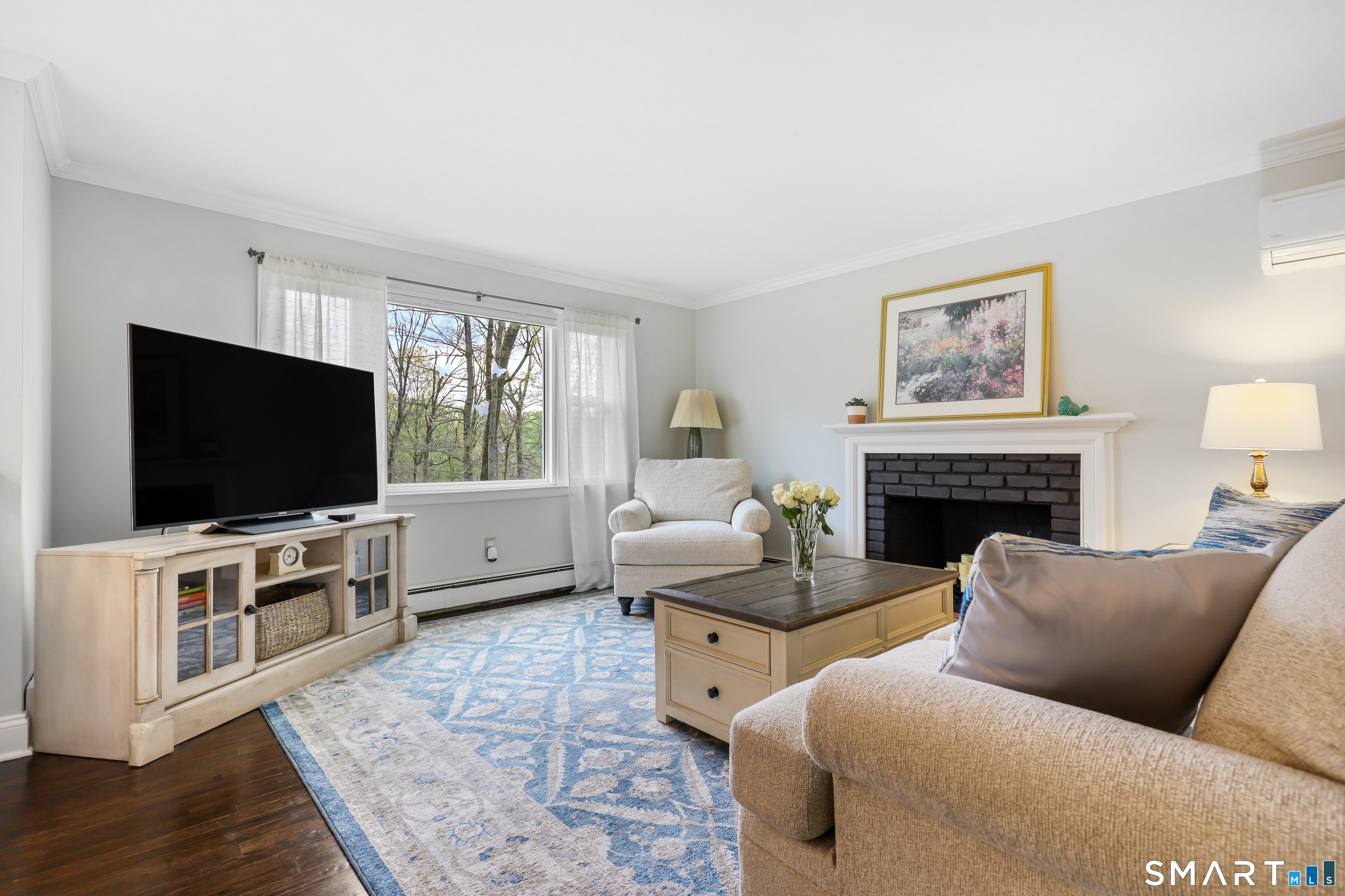 100 Flat Rock Drive Ridgefield, CT 06877 - Photo 4 of 40 a living room with furniture and a flat screen tv