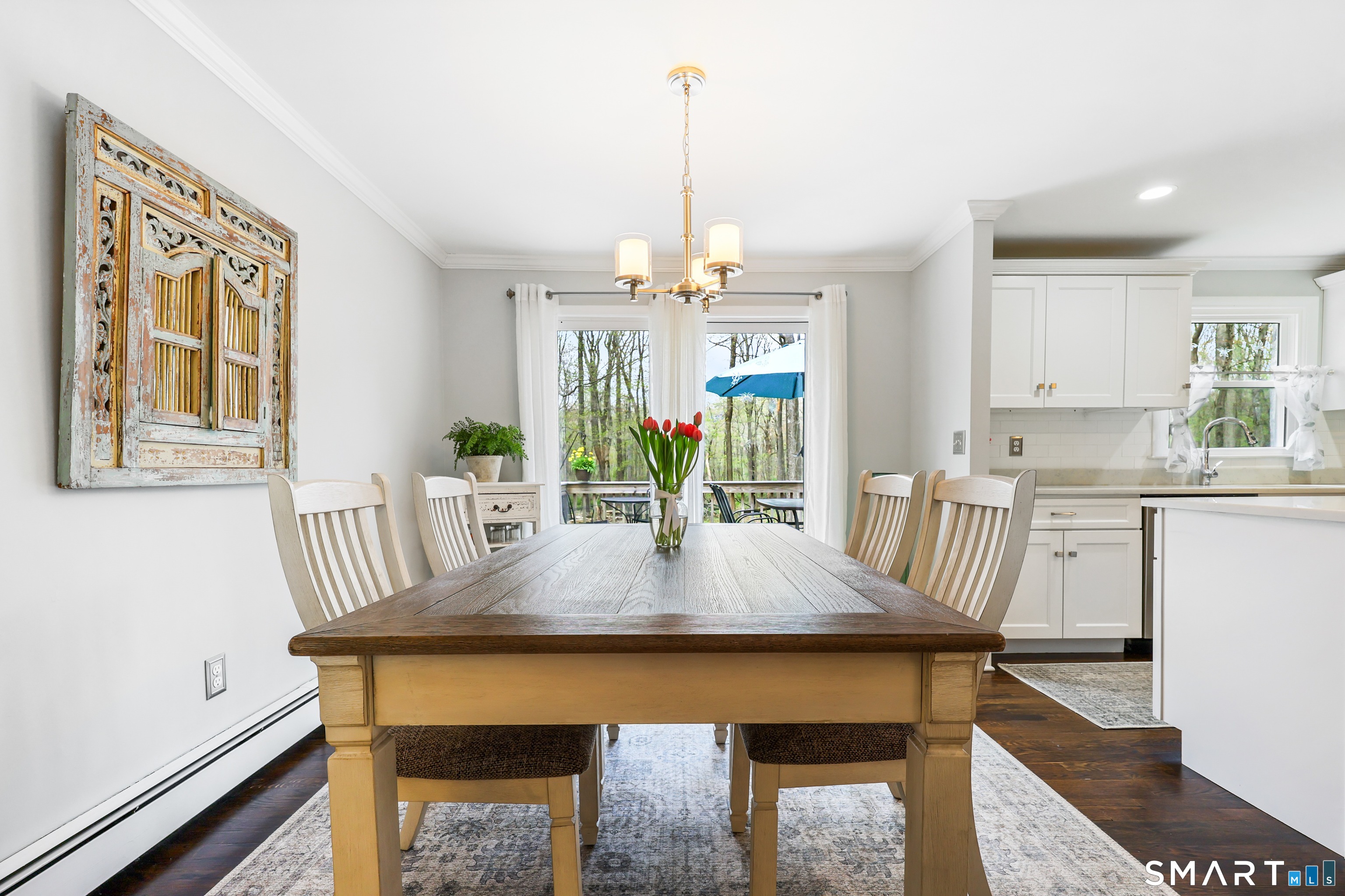 100 Flat Rock Drive Ridgefield, CT 06877 - Photo 5 of 40 a view of a dining room with furniture window and wooden floor