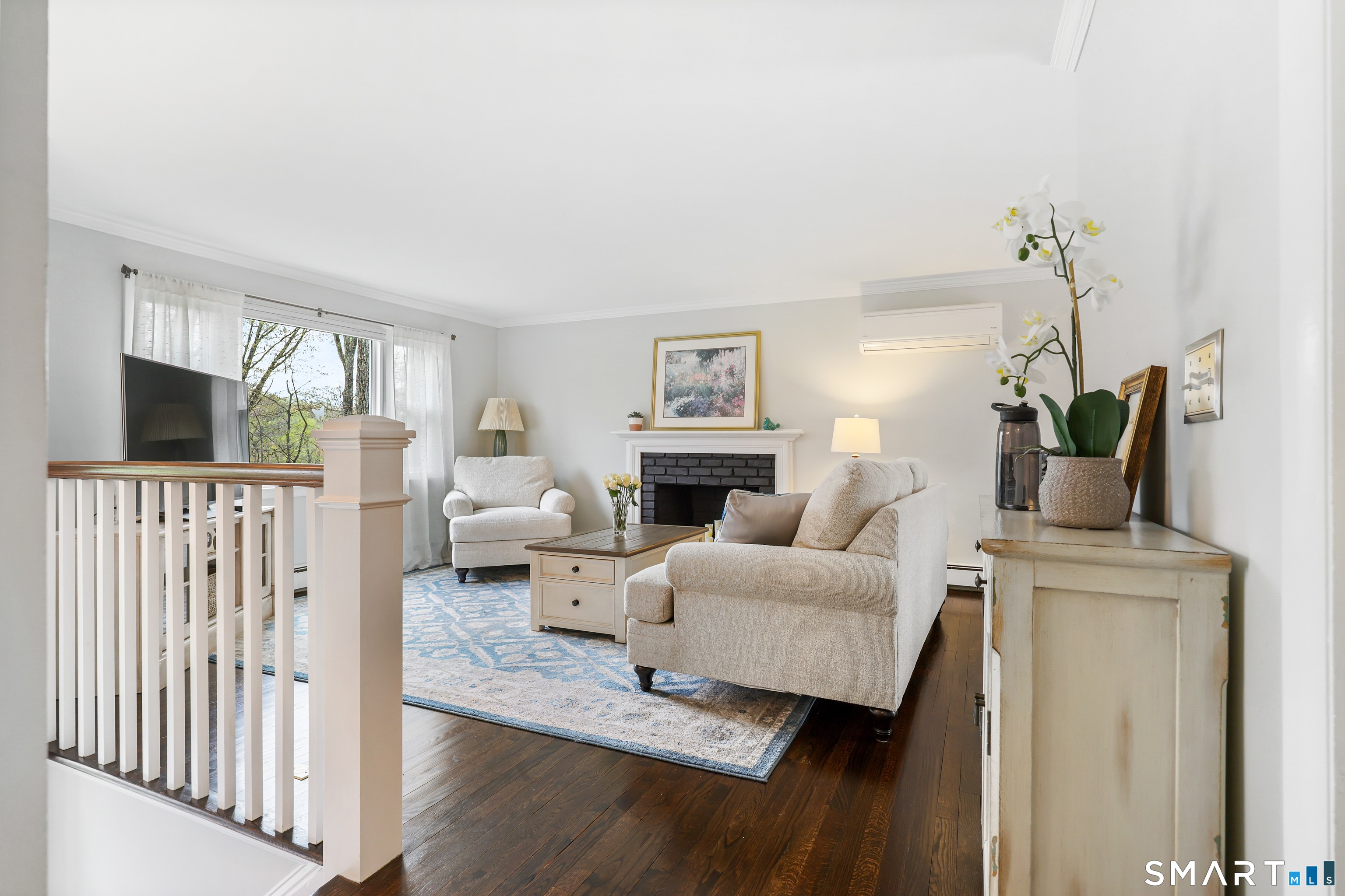 100 Flat Rock Drive Ridgefield, CT 06877 - Photo 9 of 40 a living room with furniture and a flat screen tv