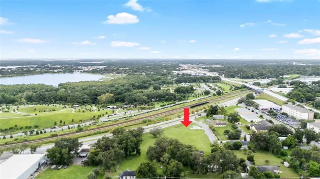 an aerial view of a house having yard
