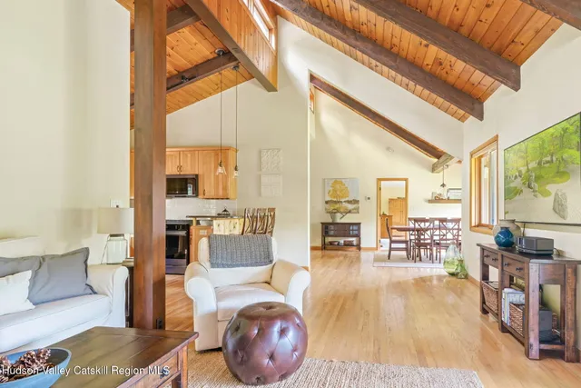 a lobby with furniture and floor to ceiling window