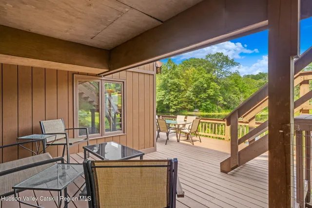 a view of two chairs in the balcony