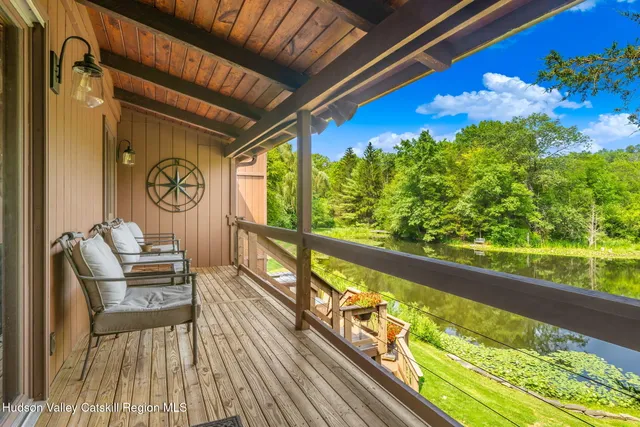 a view of a house with a large window and wooden floor