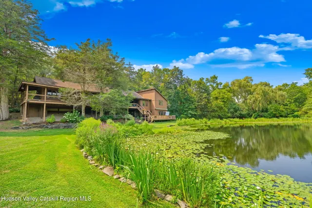 a view of a lake with a yard