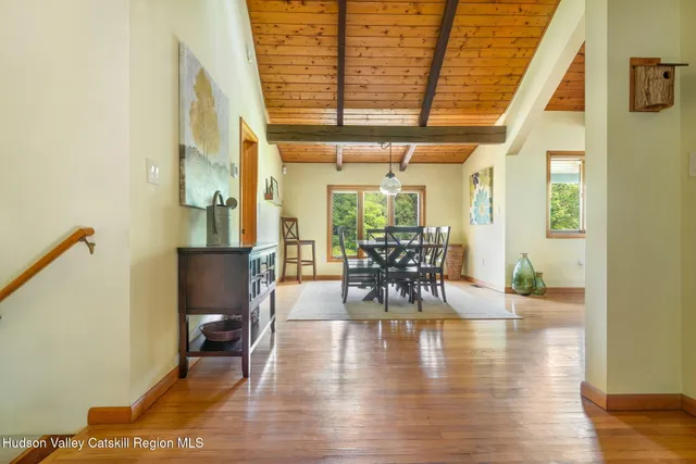 a view of a dining room with furniture window and wooden floor