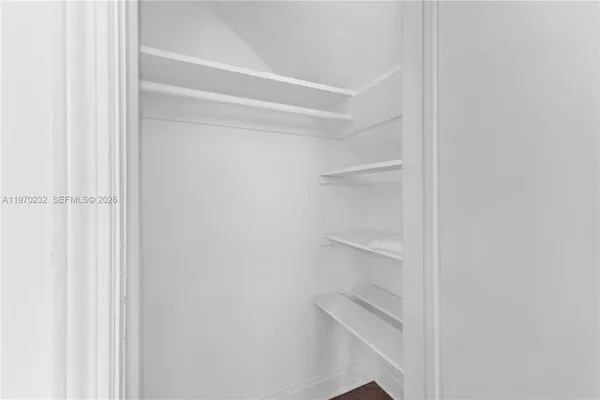 a view of an empty walk in closet