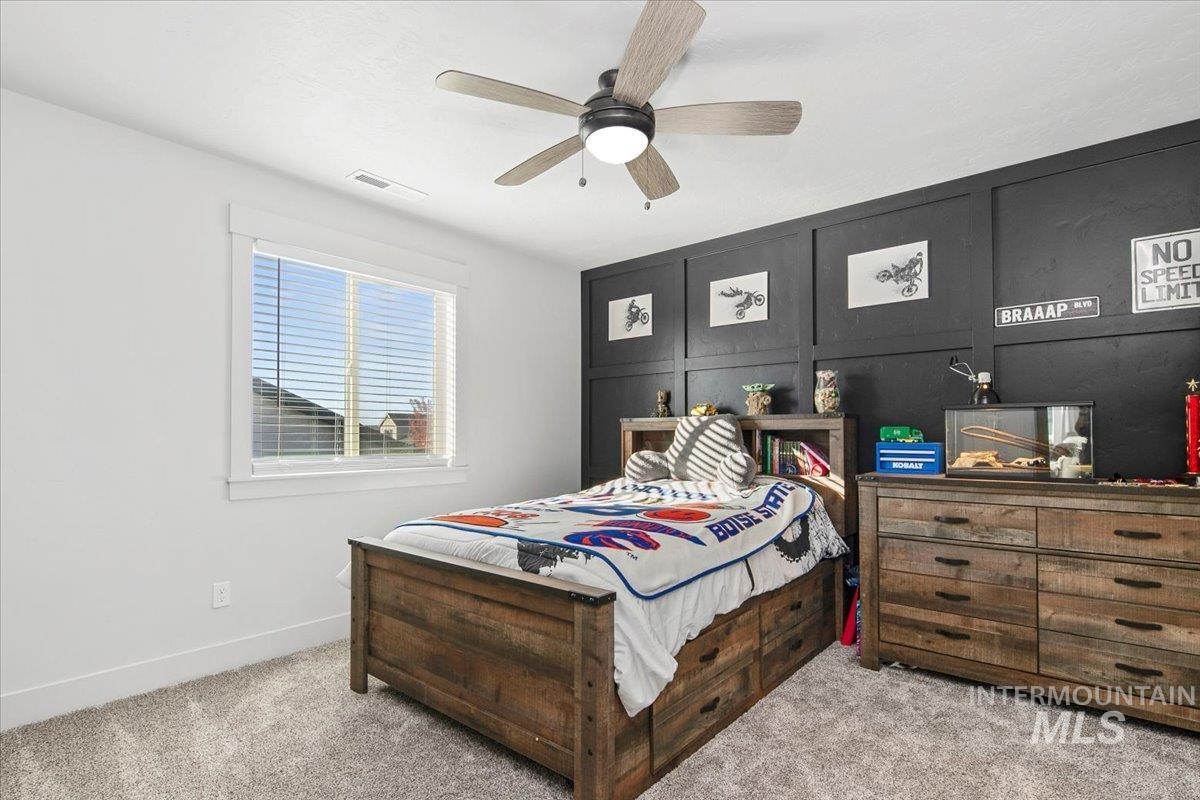 4150 East Fratello Street Meridian, ID 83642 - Photo 34 of 46 Bedroom featuring carpet floors and a ceiling fan