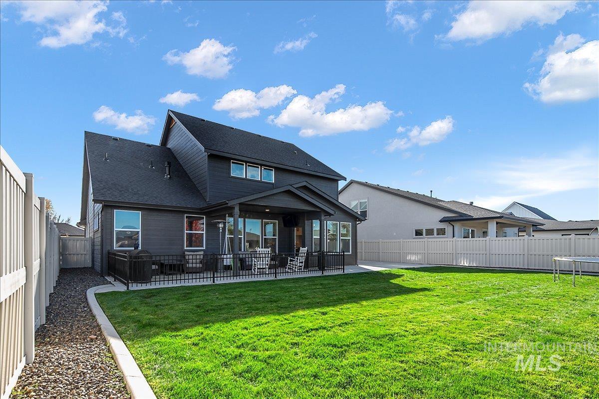 4150 East Fratello Street Meridian, ID 83642 - Photo 39 of 47 Back of property featuring a patio, a fenced backyard, and a shingled roof