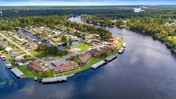 an aerial view of a house with a ocean view