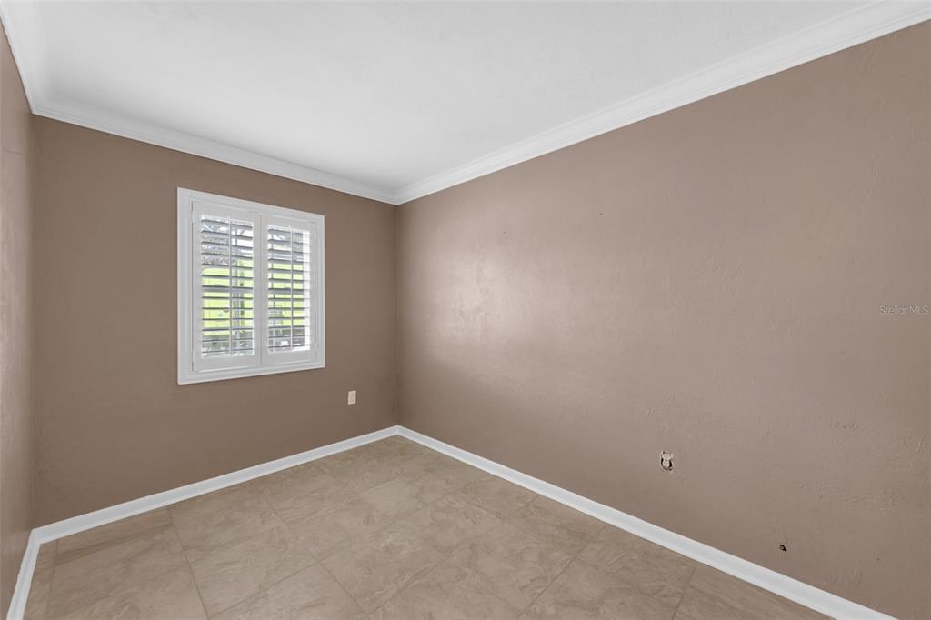 Undisclosed Address Astor, FL 32102 - Photo 14 of 28 an empty room with a window