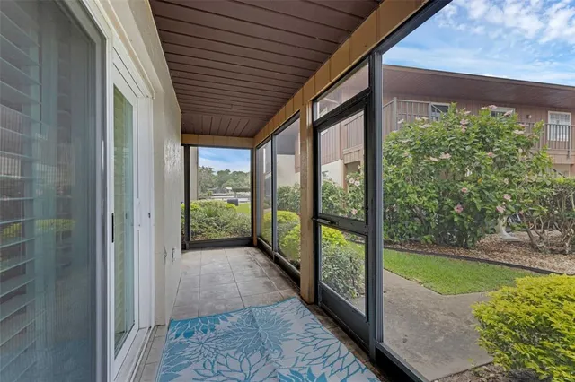 a view of a pathway that has potted plants