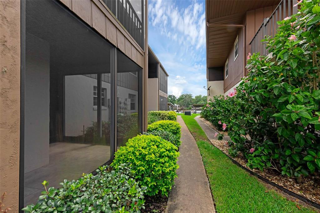 Undisclosed Address Astor, FL 32102 - Photo 22 of 28 a view of a pathway that has potted plants