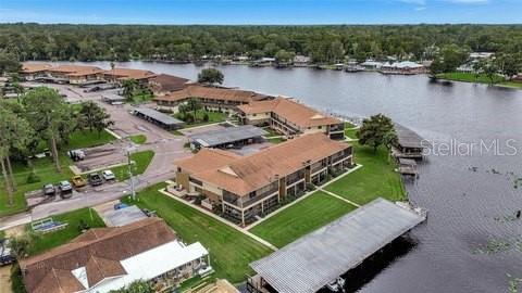 Undisclosed Address Astor, FL 32102 - Photo 24 of 28 an aerial view of a house with a lake view