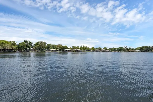 an aerial view of a house with a swimming pool yard and outdoor seating