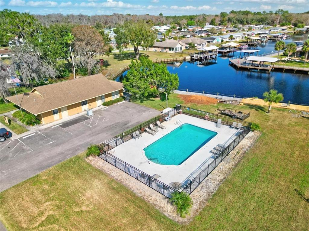 Undisclosed Address Astor, FL 32102 - Photo 28 of 28 an aerial view of a house with a swimming pool yard and outdoor seating