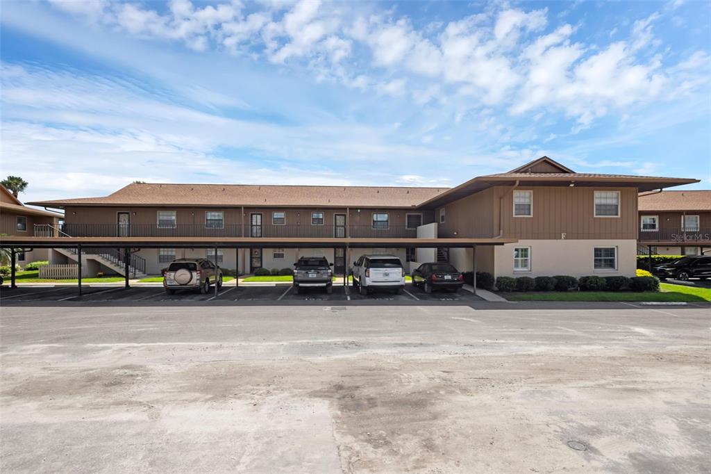 Undisclosed Address Astor, FL 32102 - Photo 3 of 28 a front view of a house with garage