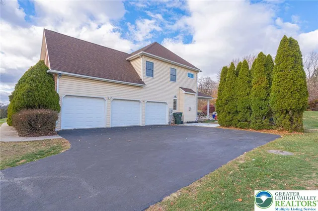 a kitchen with stainless steel appliances granite countertop a stove and a refrigerator