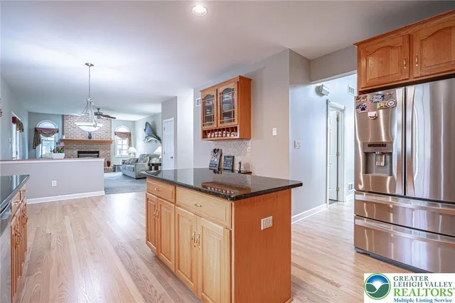 a bath tub sitting in a bathroom next to a window
