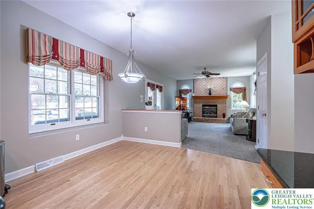 a spacious bedroom with a bed and window