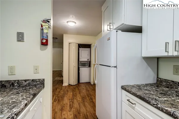 a kitchen with a refrigerator and countertop