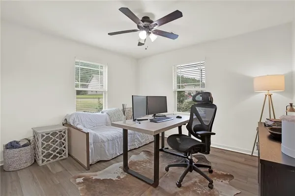 a workspace with furniture and a window
