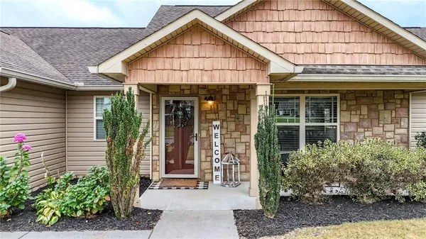 a front view of a house with garden
