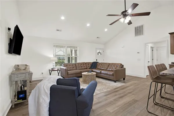 a living room with furniture and a flat screen tv
