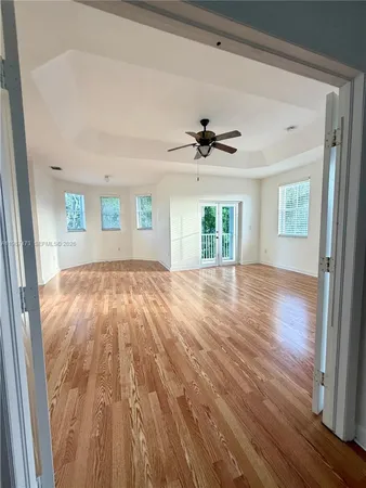 a spacious bathroom with a sink and a mirror