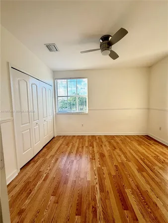 a view of house with swimming pool and sitting area