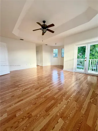 a spacious bathroom with a granite countertop sink mirror and a bathtub