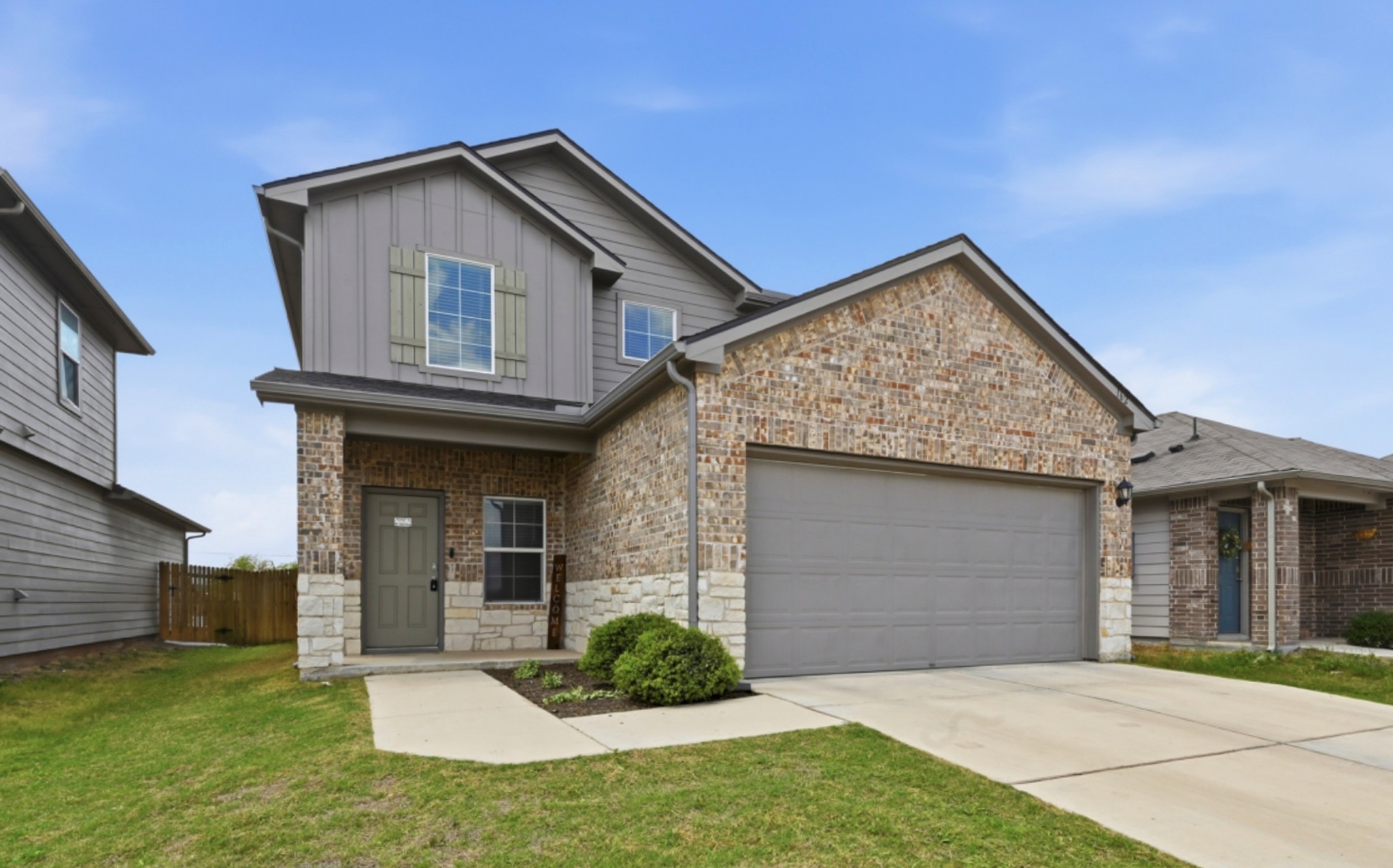 162 Euclid Lane Kyle, TX 78640 - Photo 1 of 1 a front view of a house with a garden and yard
