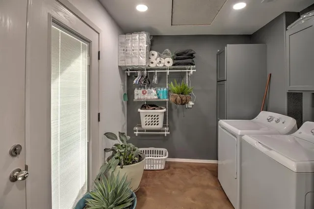a kitchen that has a sink cabinets counter space and appliances