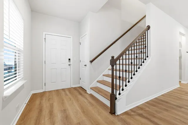 a view of entryway with wooden floor