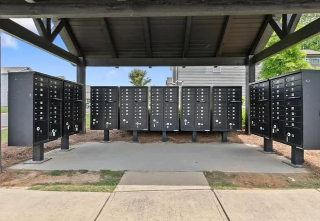 a view of a house with a yard and sitting area
